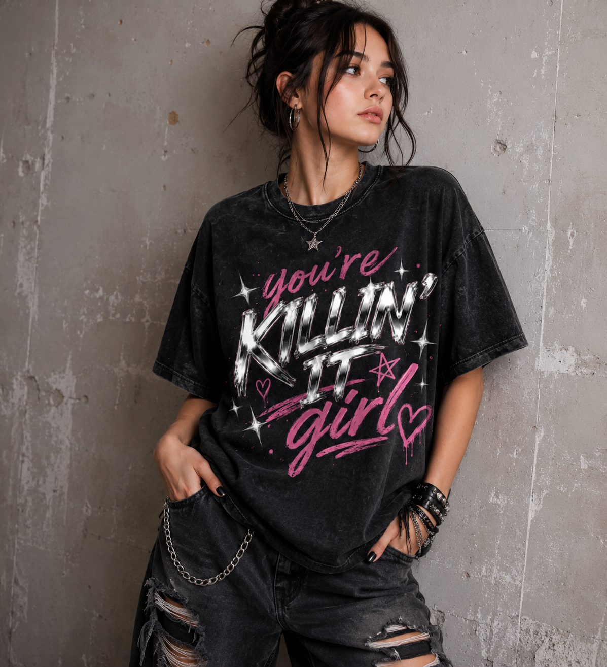Model wearing You’re Killin’ It Girl black oversized graphic tee with pink chrome Y2K design