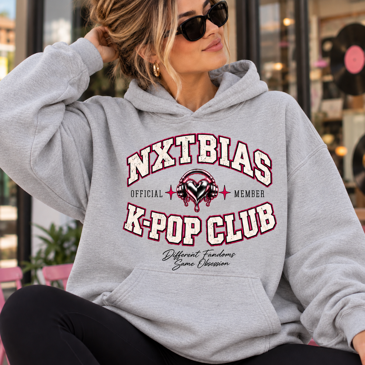 Woman wearing heather gray NXTBIAS Official K-Pop Club Member hoodie