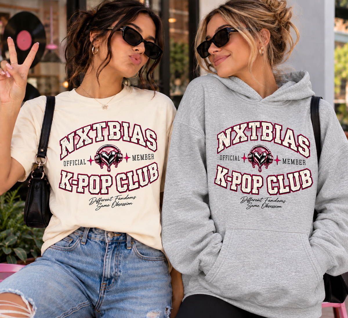 Two women wearing NXTBIAS K-Pop Club member T-shirt and hoodie