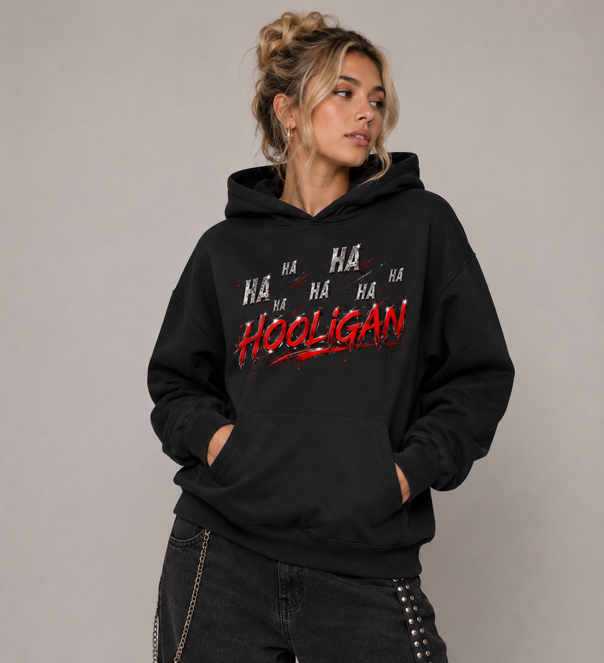 Model wearing black Hooligan graphic hoodie with red and chrome Y2K design
