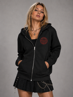 Woman wearing black Buenos Aires Concert Zip Hoodie with NXTBIAS front graphic